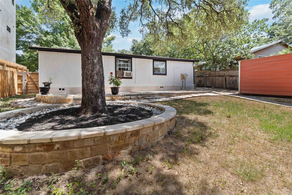 1002 Walter Street Austin, TX 78702 - Photo 24 of 31 a view of a backyard with a tree