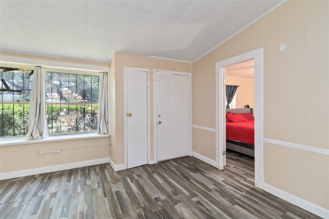 1002 Walter Street Austin, TX 78702 - Photo 9 of 31 a view of a room with wooden floor and a window