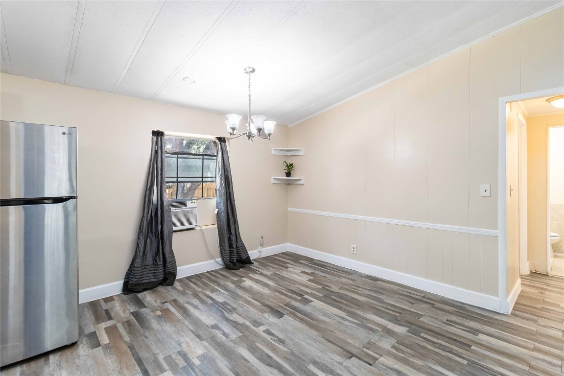 1002 Walter Street Austin, TX 78702 - Photo 10 of 31 a view of empty room with wooden floor and stairs