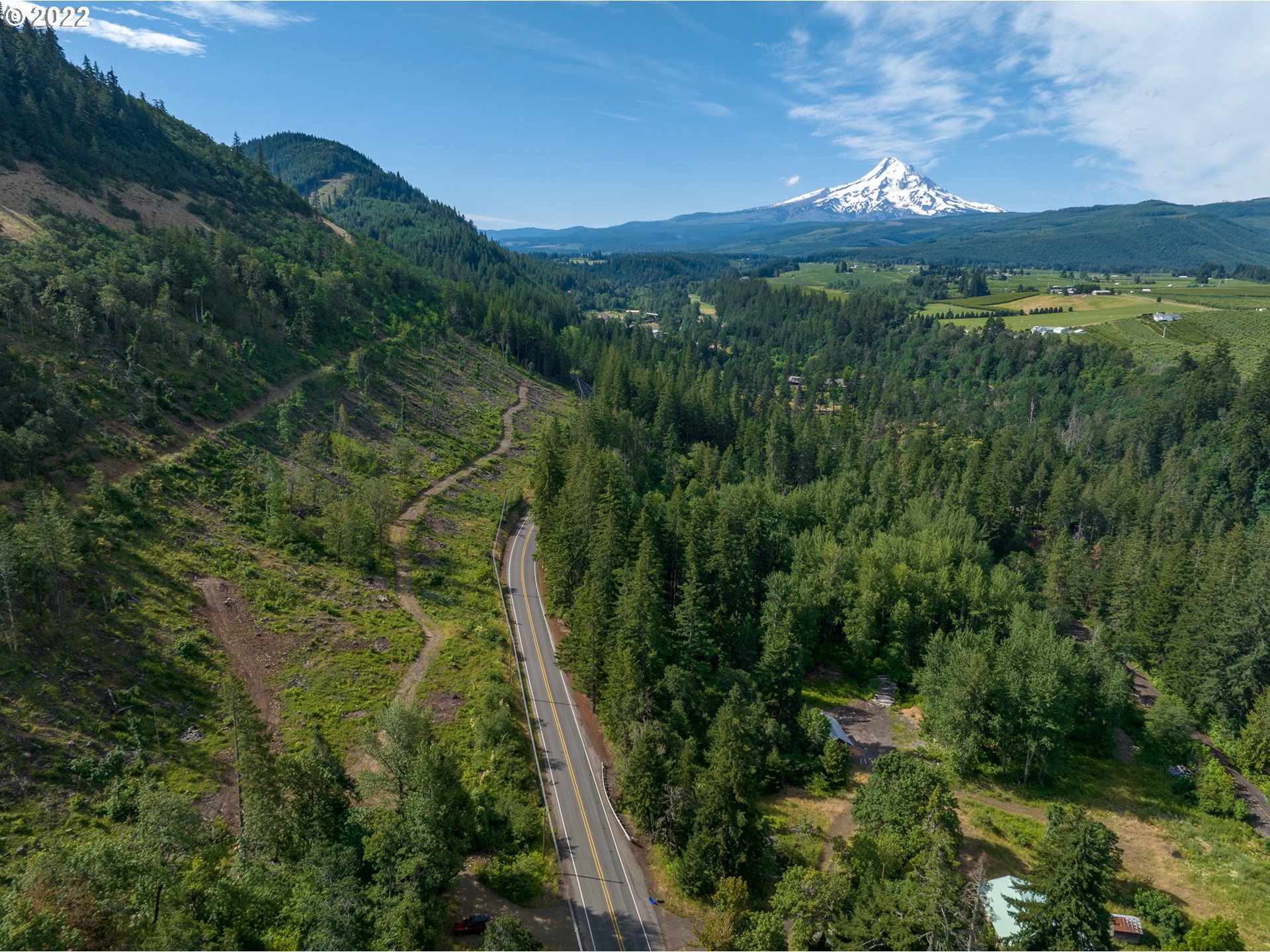 4397 Dee Highway Hood River, OR 97031 - Photo 7 of 15 a view of a lush green forest with a houses