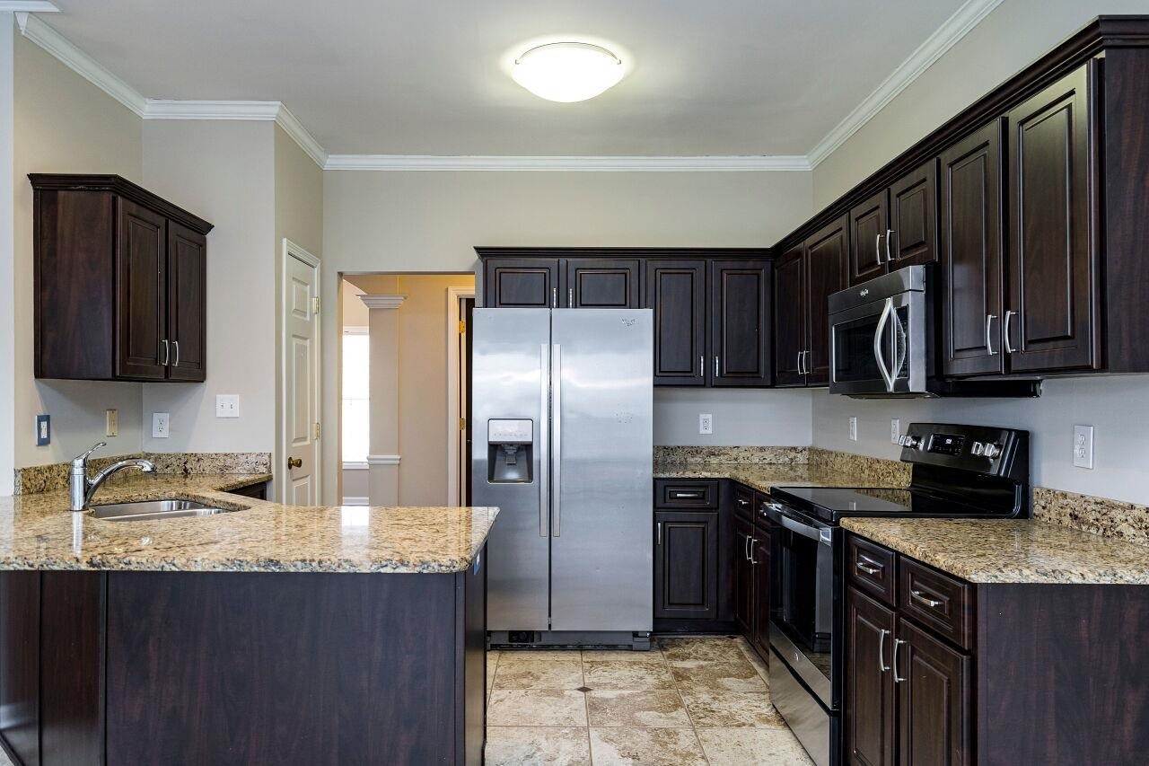 600 Three Meadows Road Fuquay-Varina, NC 27526 - Photo 9 of 30 The efficient kitchen will be a joy to cook in. Kitchen