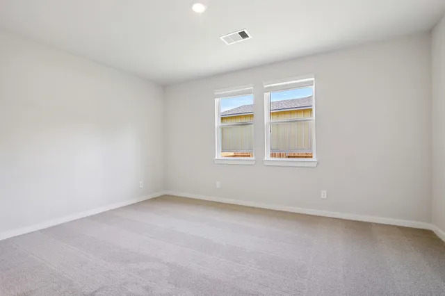 a bathroom with double sink and a mirror
