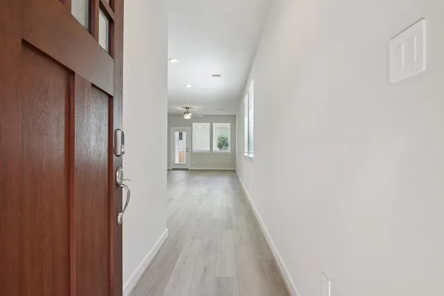 a view of kitchen with granite countertop cabinets and steel stainless steel appliances