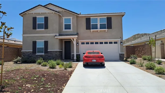 a front view of a house with outdoor space