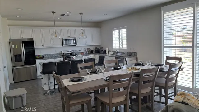 a view of a dining room with furniture