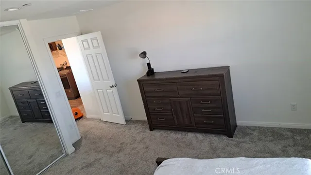 a room with a dresser and a mirror