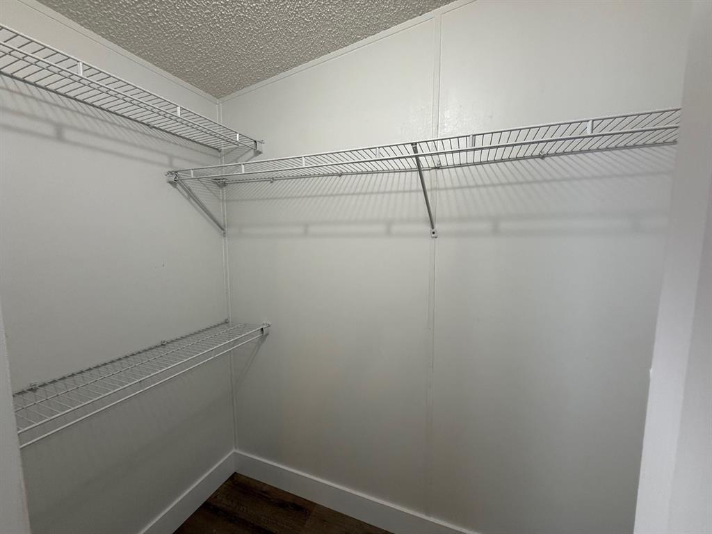 8648 Southwest 16th Place Davie, FL 33324 - Photo 4 of 10 a view of a room with racks on the wall