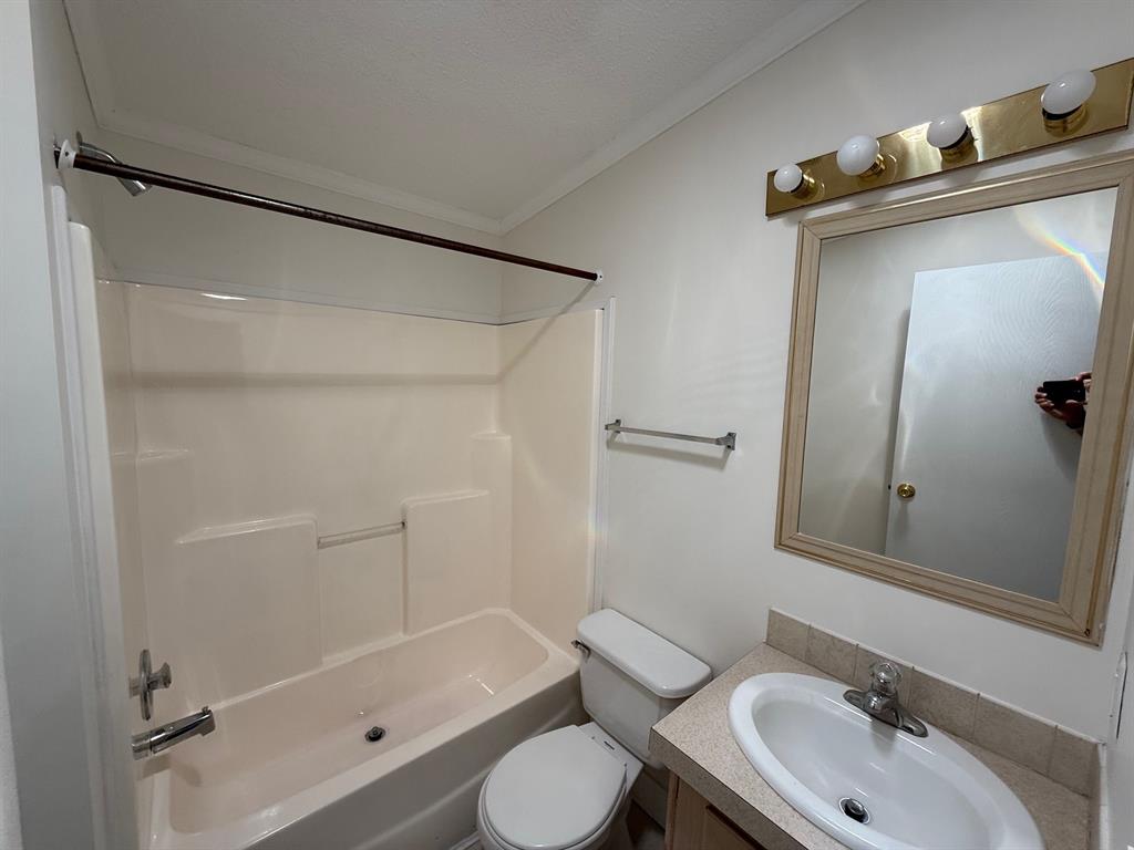 8648 Southwest 16th Place Davie, FL 33324 - Photo 10 of 10 a bathroom with a sink toilet and shower