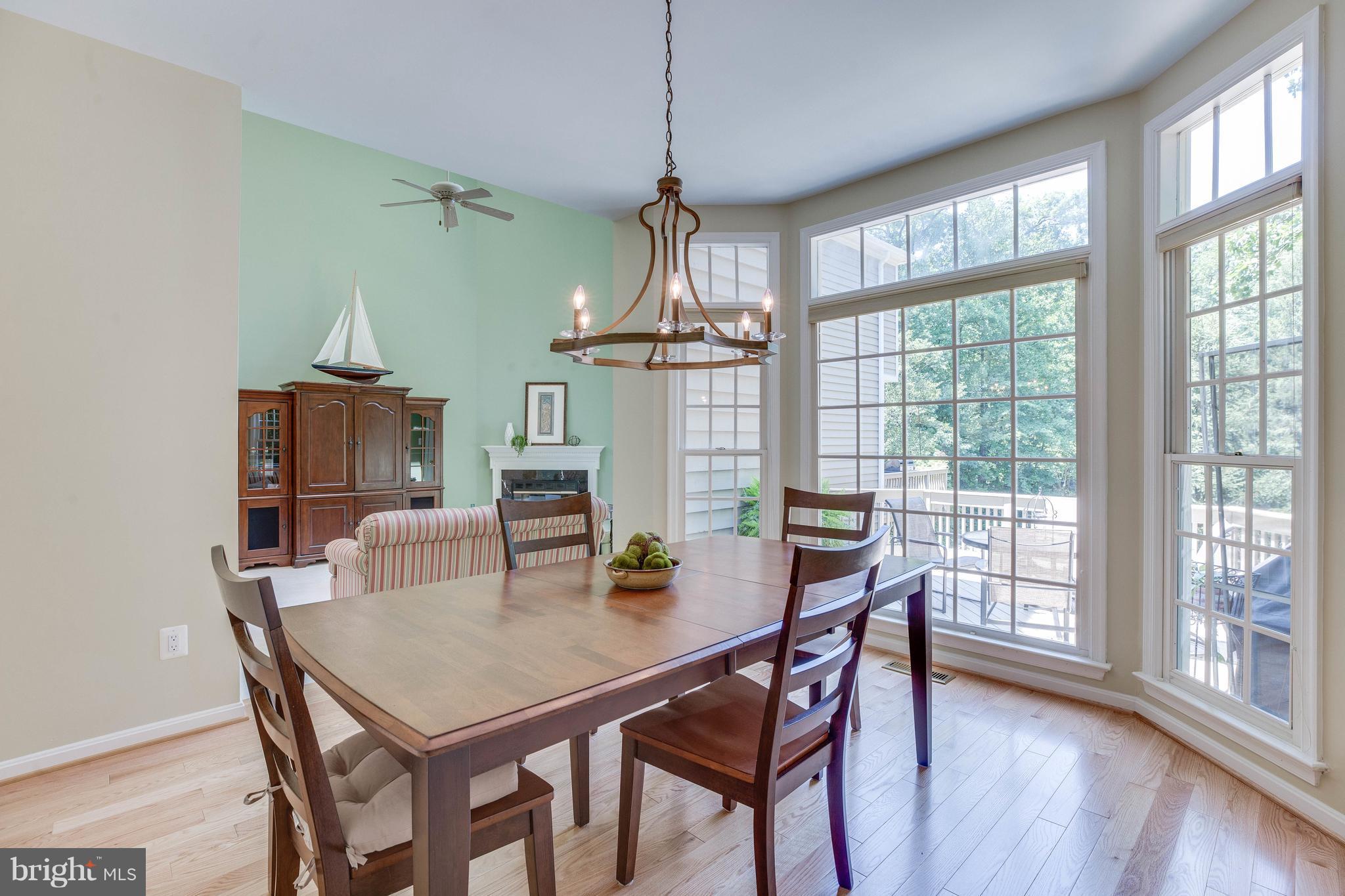 11446 Hollow Timber Court Reston, VA 20194 - Photo 12 of 29 a view of a dining room with furniture window and wooden floor