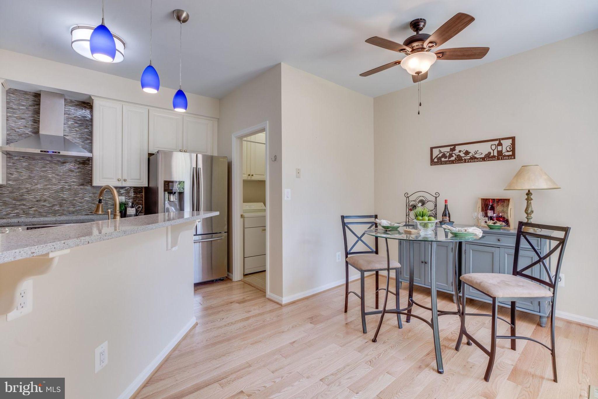 11446 Hollow Timber Court Reston, VA 20194 - Photo 14 of 29 a kitchen with stainless steel appliances granite countertop a refrigerator and a stove top oven