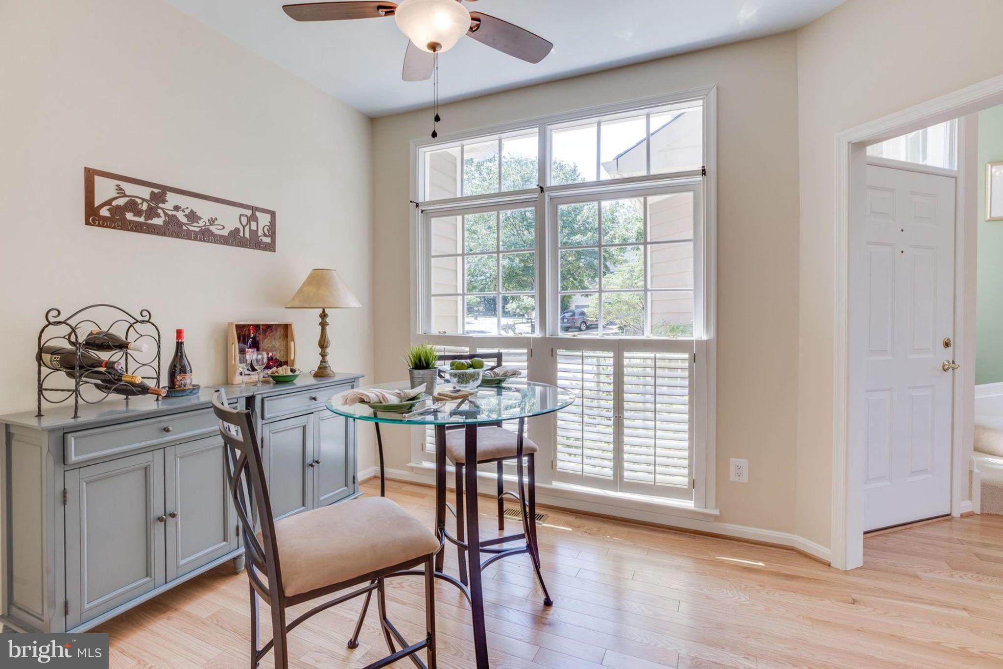 11446 Hollow Timber Court Reston, VA 20194 - Photo 15 of 29 a view of a dining room with furniture window and wooden floor