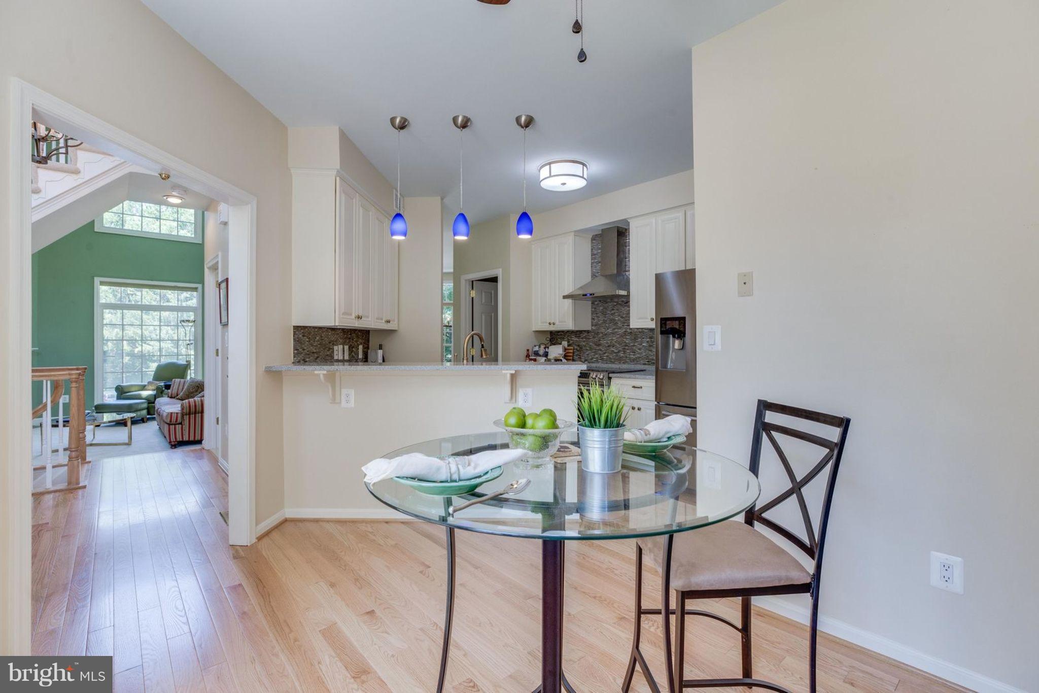 11446 Hollow Timber Court Reston, VA 20194 - Photo 17 of 29 a view of a dining room with furniture and wooden floor