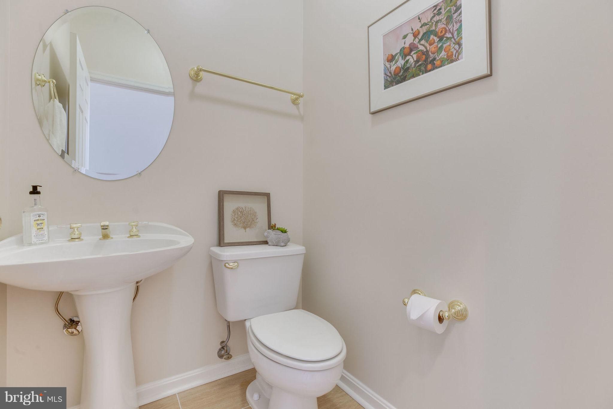 11446 Hollow Timber Court Reston, VA 20194 - Photo 20 of 29 a bathroom with a toilet sink and mirror