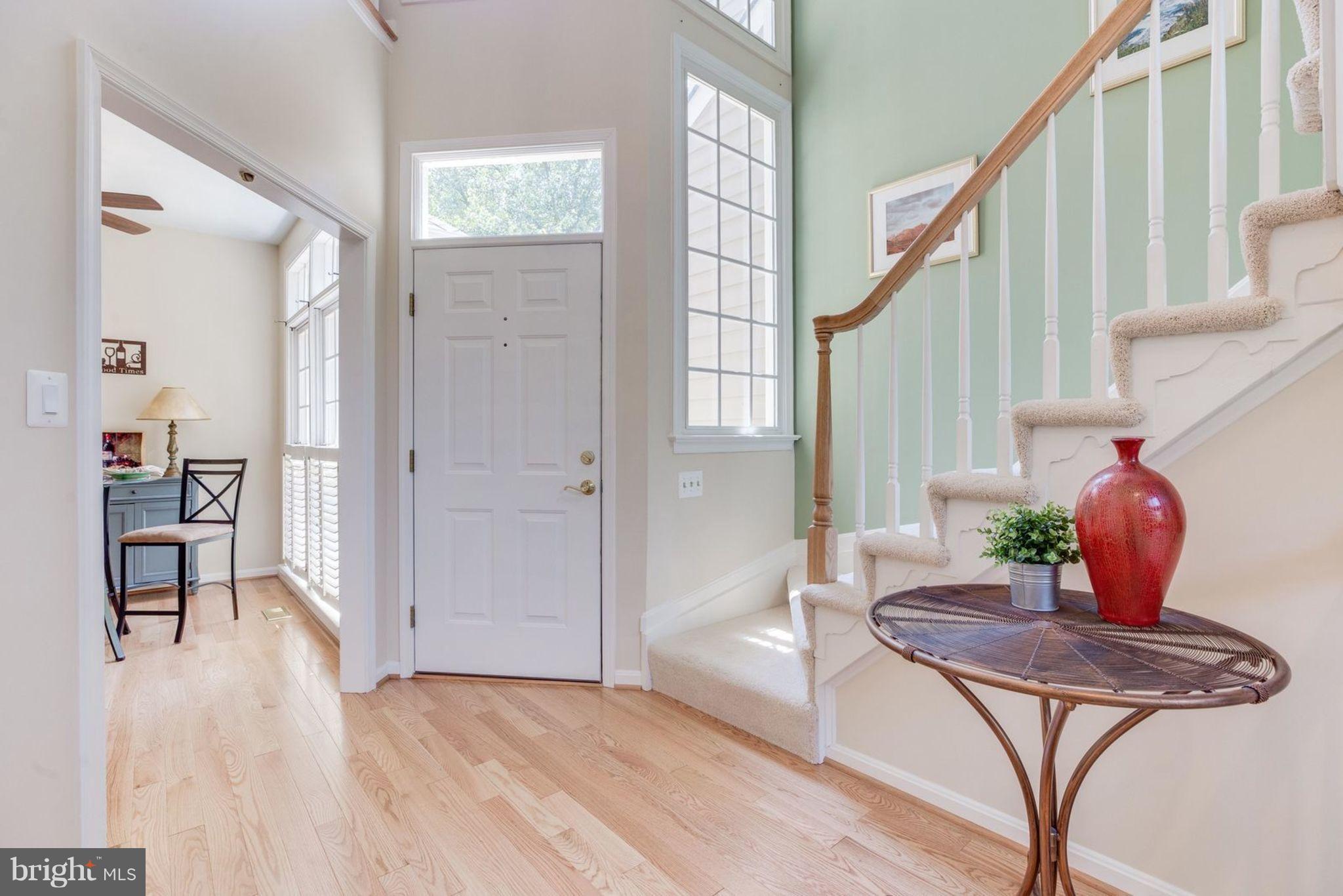 11446 Hollow Timber Court Reston, VA 20194 - Photo 5 of 29 a living room with furniture and a potted plant