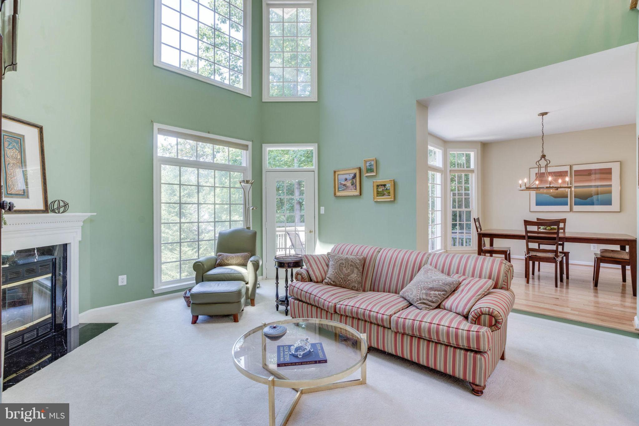 11446 Hollow Timber Court Reston, VA 20194 - Photo 8 of 29 a living room with furniture a fireplace and a window