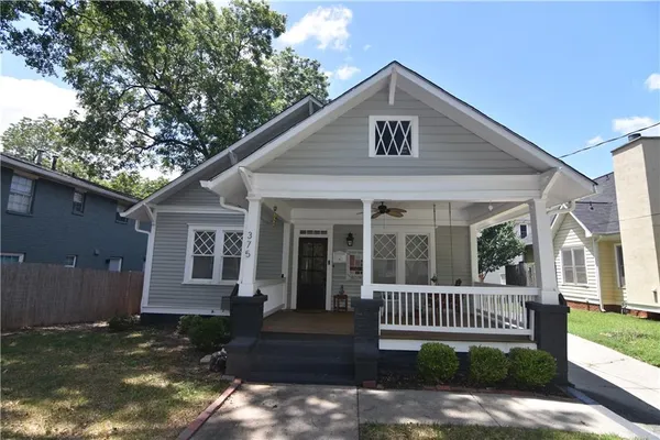 a front view of a house with a porch