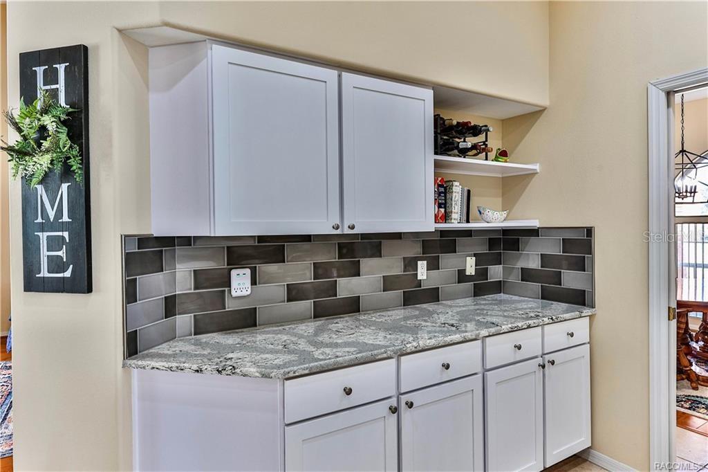5420 North Rosedale Circle Beverly Hills, FL 34465 - Photo 14 of 49 a bathroom with a granite countertop sink and a mirror