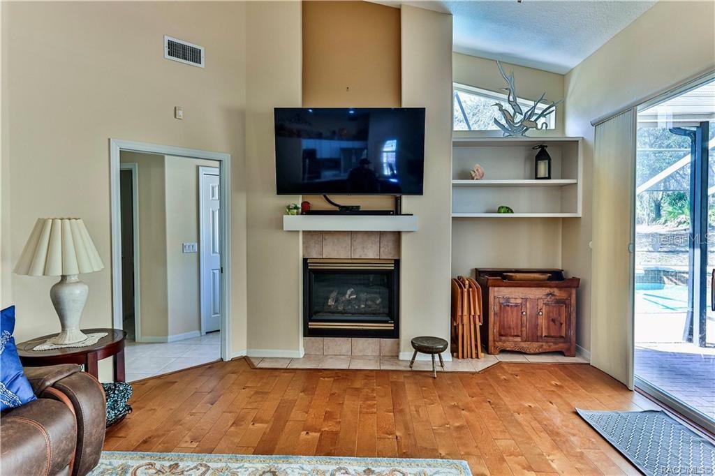 5420 North Rosedale Circle Beverly Hills, FL 34465 - Photo 19 of 49 a living room with furniture flat screen tv and a fireplace