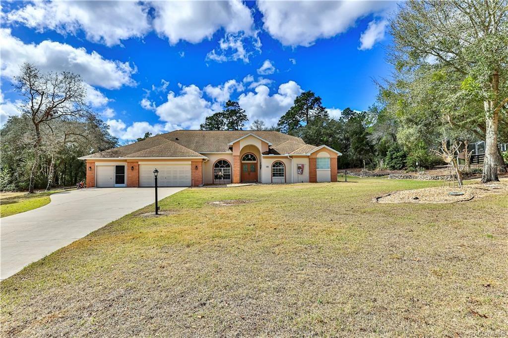 5420 North Rosedale Circle Beverly Hills, FL 34465 - Photo 2 of 49 a view of a house with a yard