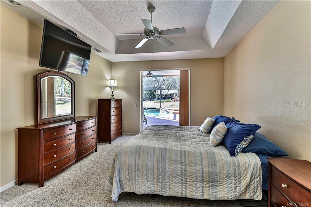 5420 North Rosedale Circle Beverly Hills, FL 34465 - Photo 22 of 49 a bedroom with a bed and a dresser