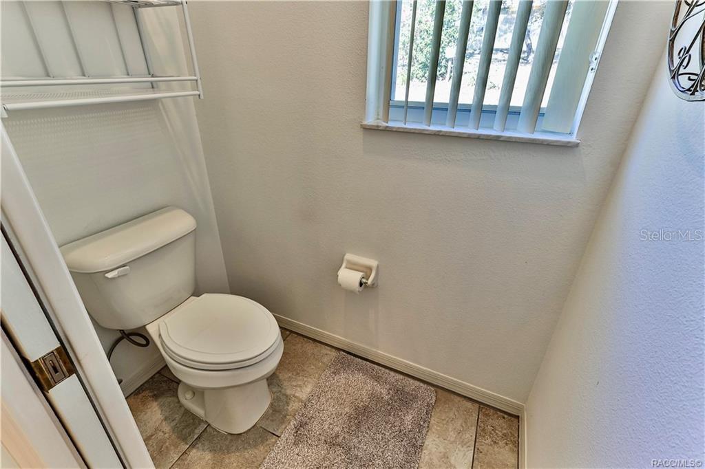 5420 North Rosedale Circle Beverly Hills, FL 34465 - Photo 26 of 49 a bathroom with a toilet and a sink