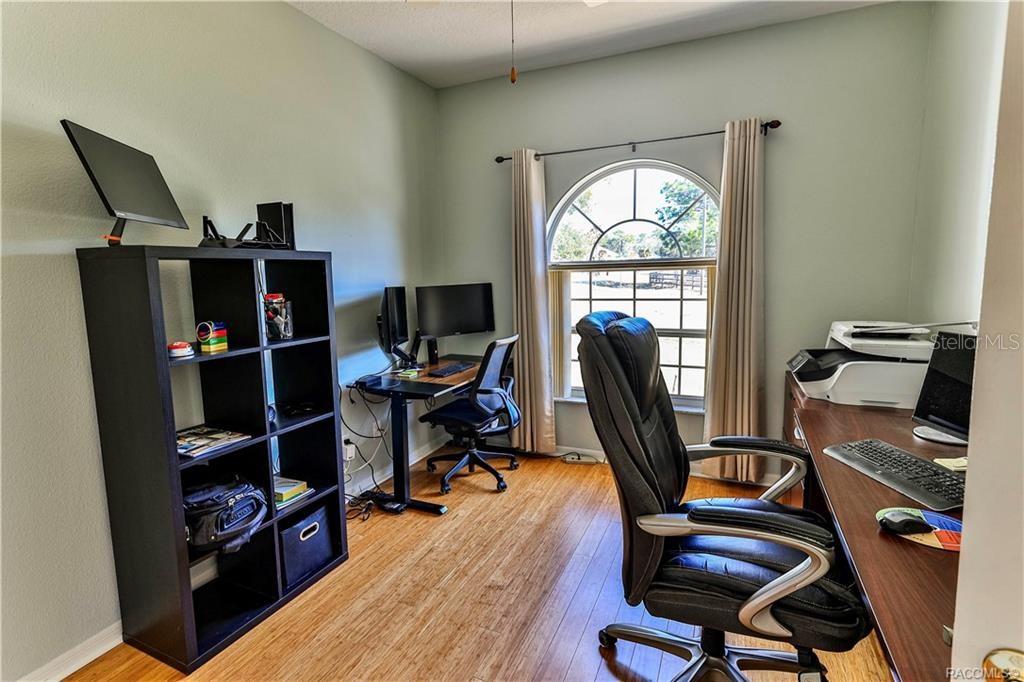 5420 North Rosedale Circle Beverly Hills, FL 34465 - Photo 27 of 49 a view of a workspace with furniture and a window