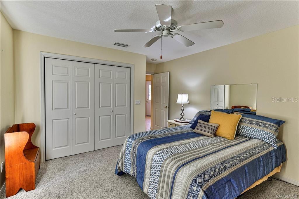 5420 North Rosedale Circle Beverly Hills, FL 34465 - Photo 28 of 49 a bedroom with a bed and closet