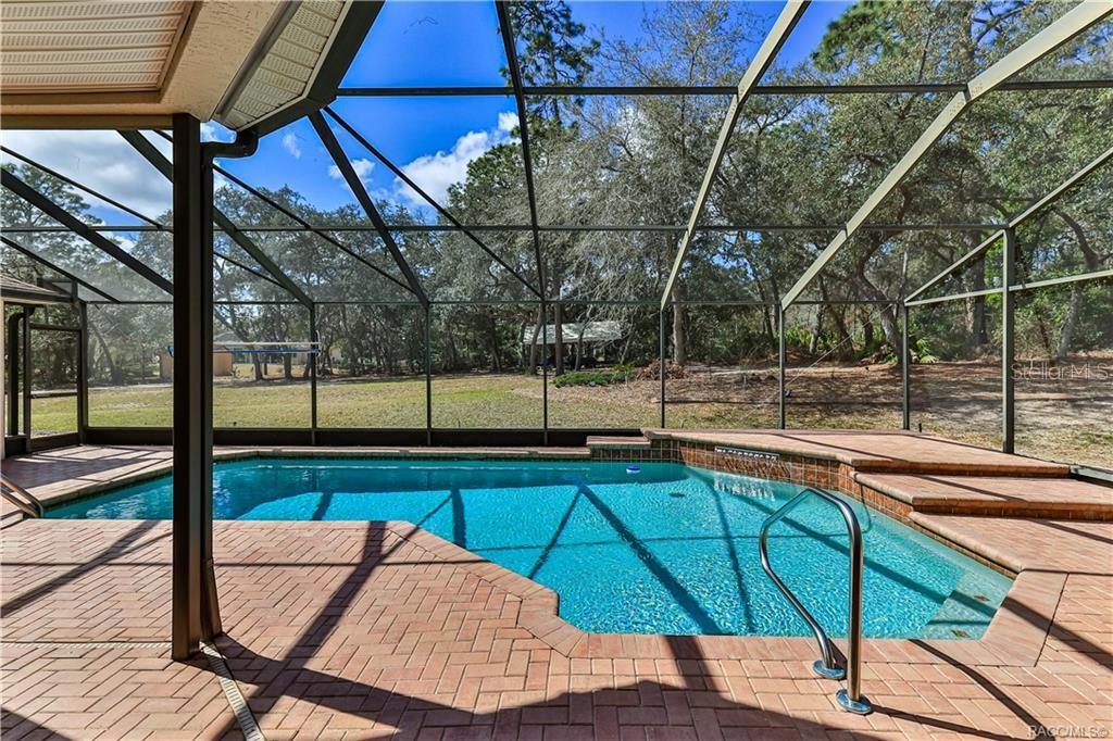 5420 North Rosedale Circle Beverly Hills, FL 34465 - Photo 33 of 49 a view of a backyard with sitting area
