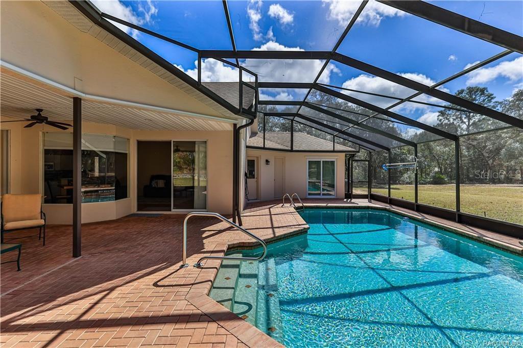 5420 North Rosedale Circle Beverly Hills, FL 34465 - Photo 36 of 49 a view of a house with lounge chair
