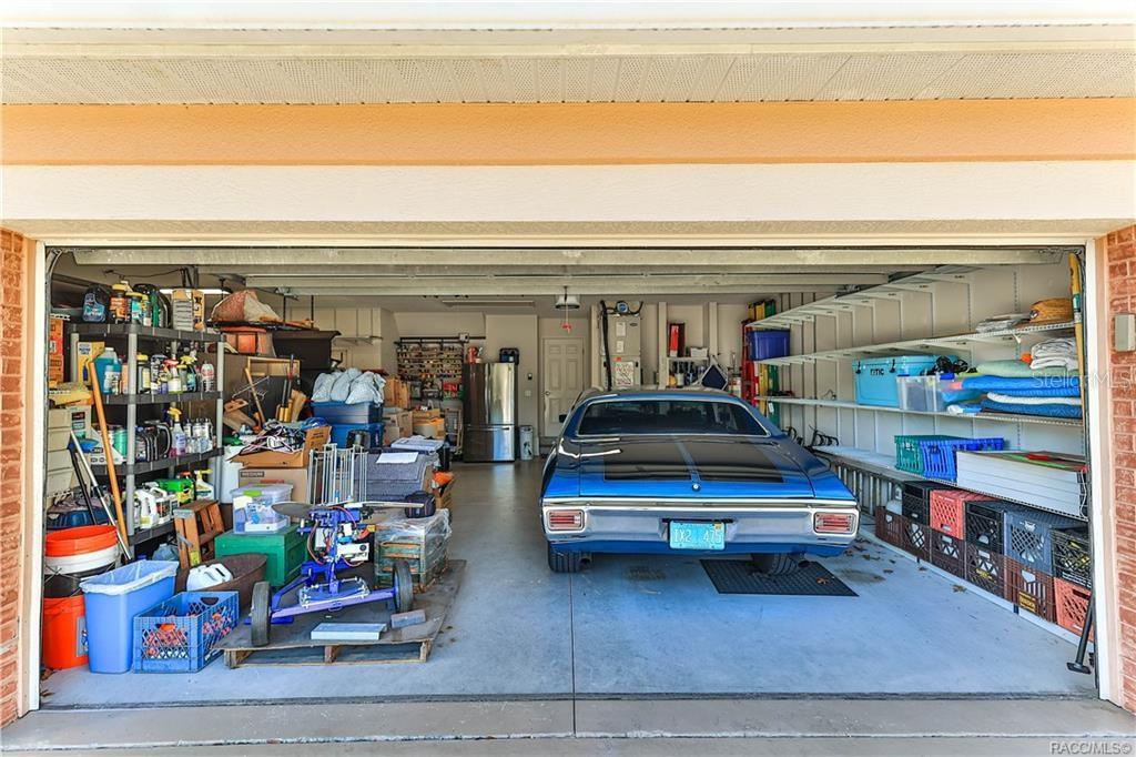 5420 North Rosedale Circle Beverly Hills, FL 34465 - Photo 40 of 49 a car parked in front of a store
