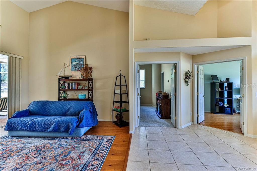 5420 North Rosedale Circle Beverly Hills, FL 34465 - Photo 5 of 49 a living room with a couch and a dresser with wooden floor