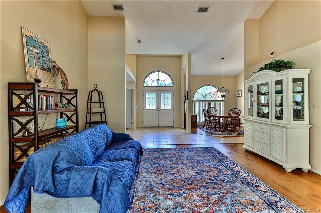 5420 North Rosedale Circle Beverly Hills, FL 34465 - Photo 6 of 49 a living room with furniture and a wooden floor