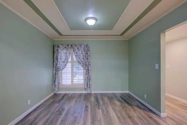 a spacious bathroom with a sink a mirror and a shower