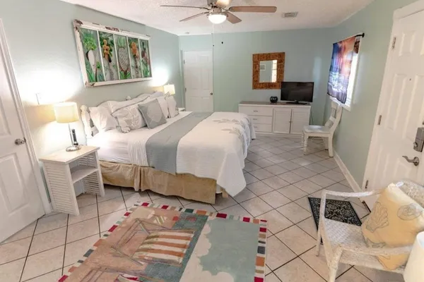 a bathroom with a granite countertop sink and a washing machine