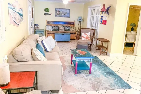 a living room with furniture and a flat screen tv