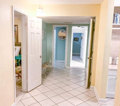 a view of a hallway with wooden shelves