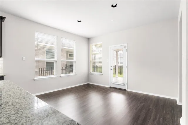 a kitchen with stainless steel appliances granite countertop a sink stove and cabinets