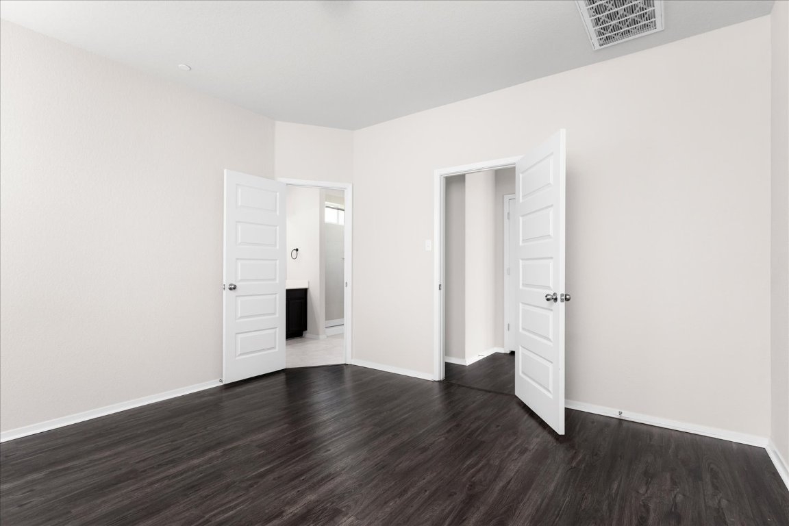 2800 Joe Dimaggio Boulevard, Unit 100 Round Rock, TX 78665 - Photo 13 of 33 an empty room with wooden floor