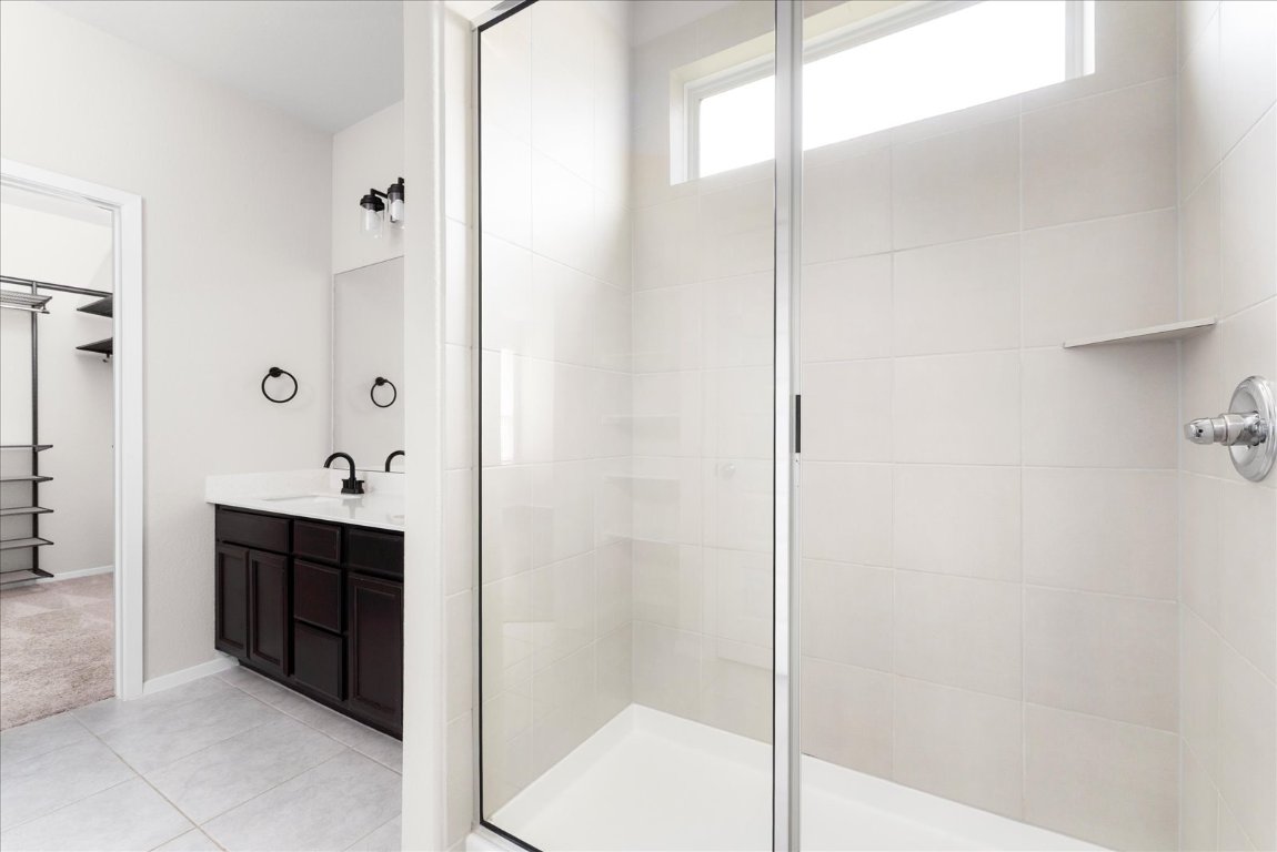 2800 Joe Dimaggio Boulevard, Unit 100 Round Rock, TX 78665 - Photo 15 of 33 a bathroom with a shower and a sink