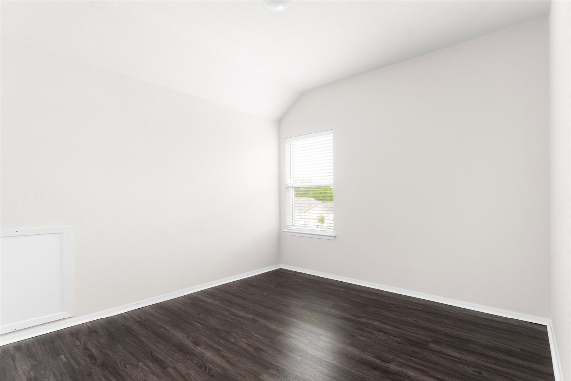 2800 Joe Dimaggio Boulevard, Unit 100 Round Rock, TX 78665 - Photo 19 of 33 a view of an empty room and wooden floor