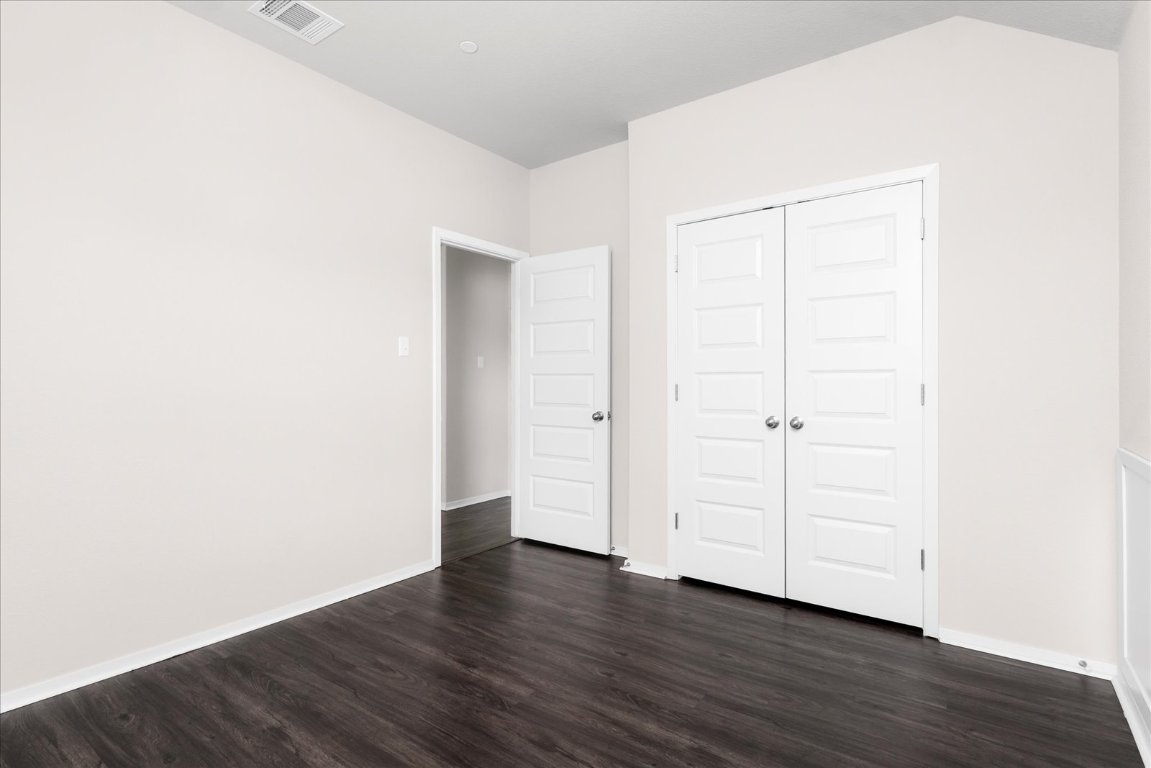 2800 Joe Dimaggio Boulevard, Unit 100 Round Rock, TX 78665 - Photo 20 of 33 a view of an empty room with wooden floor