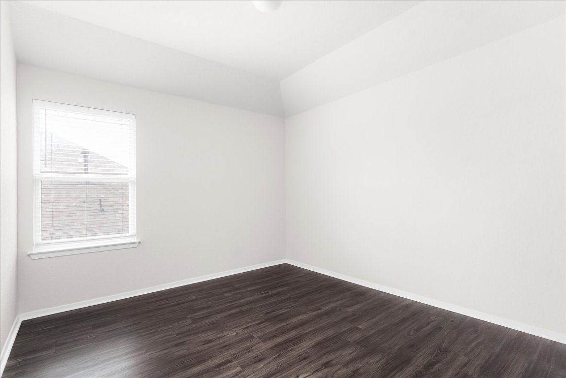 2800 Joe Dimaggio Boulevard, Unit 100 Round Rock, TX 78665 - Photo 23 of 33 an empty room with wooden floor and windows