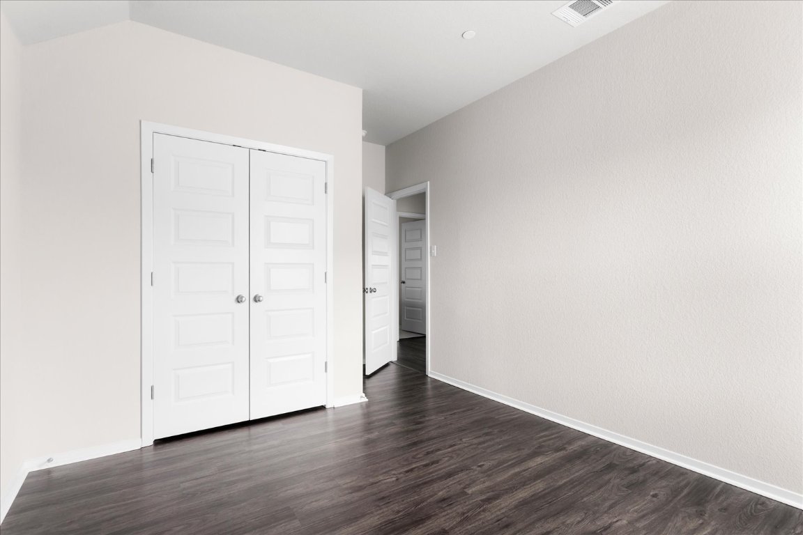 2800 Joe Dimaggio Boulevard, Unit 100 Round Rock, TX 78665 - Photo 24 of 33 a view of an empty room with wooden floor