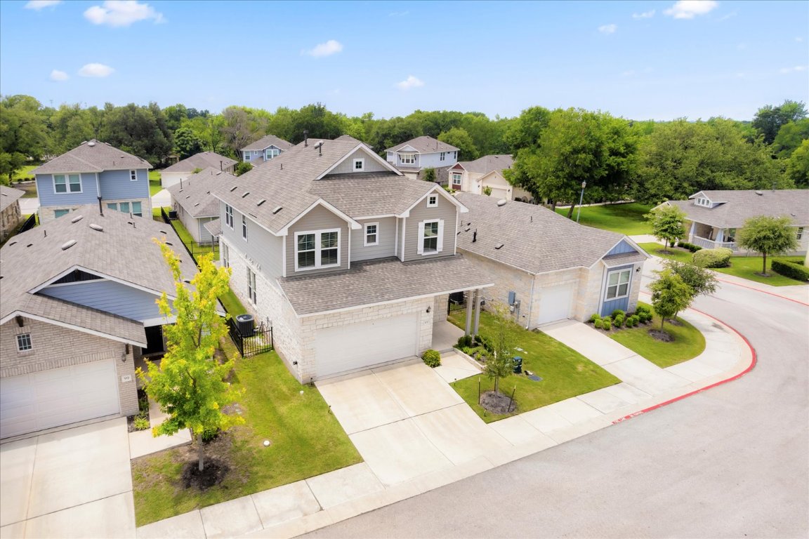 2800 Joe Dimaggio Boulevard, Unit 100 Round Rock, TX 78665 - Photo 31 of 33 a aerial view of a house with swimming pool and large trees