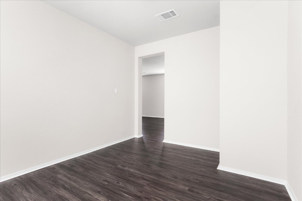 2800 Joe Dimaggio Boulevard, Unit 100 Round Rock, TX 78665 - Photo 3 of 33 a view of an empty room with wooden floor