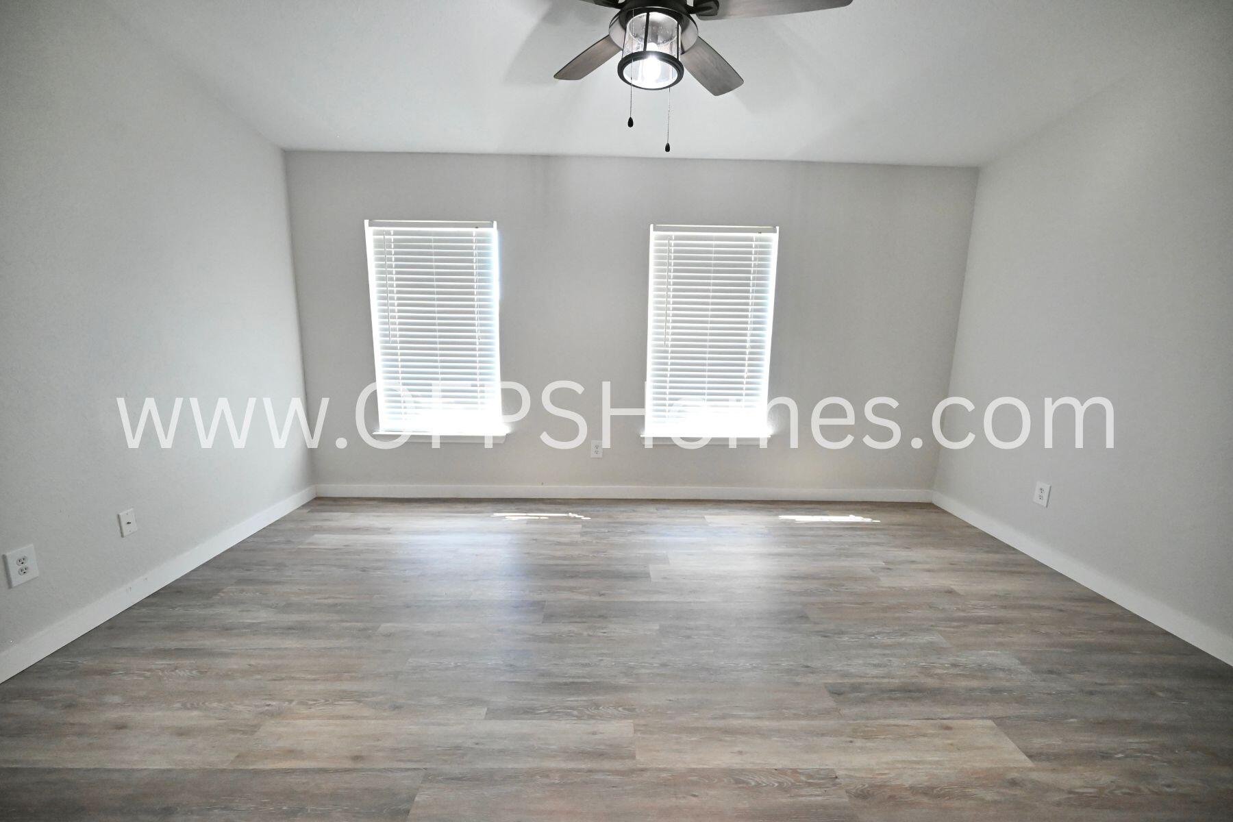 4030 Dancing Cloud Court, Unit 346 Destin, FL 32541 - Photo 13 of 19 a view of an empty room with wooden floor and a window