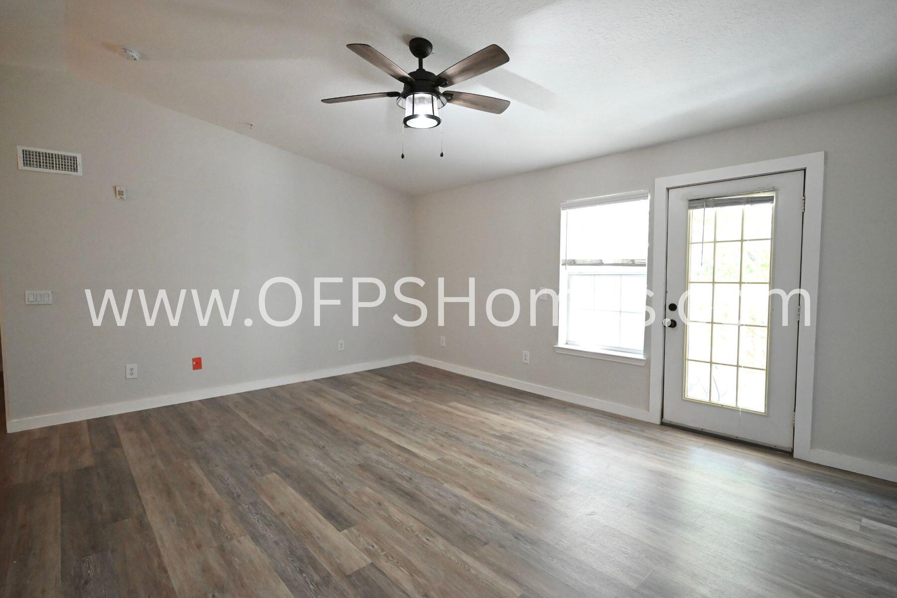 4030 Dancing Cloud Court, Unit 346 Destin, FL 32541 - Photo 2 of 19 wooden floor in an empty room with a window