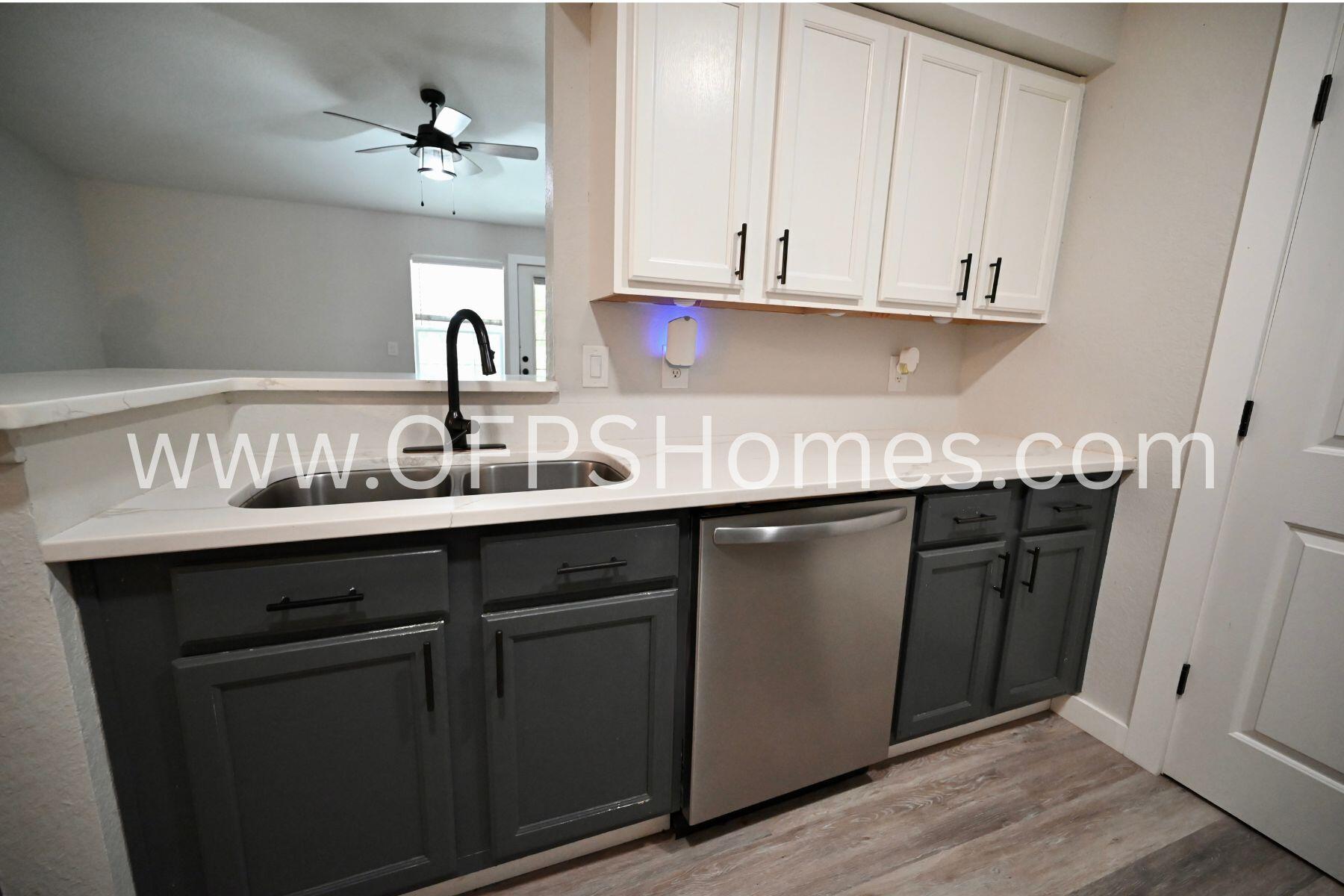 4030 Dancing Cloud Court, Unit 346 Destin, FL 32541 - Photo 7 of 19 a kitchen with stainless steel appliances granite countertop a sink and cabinets