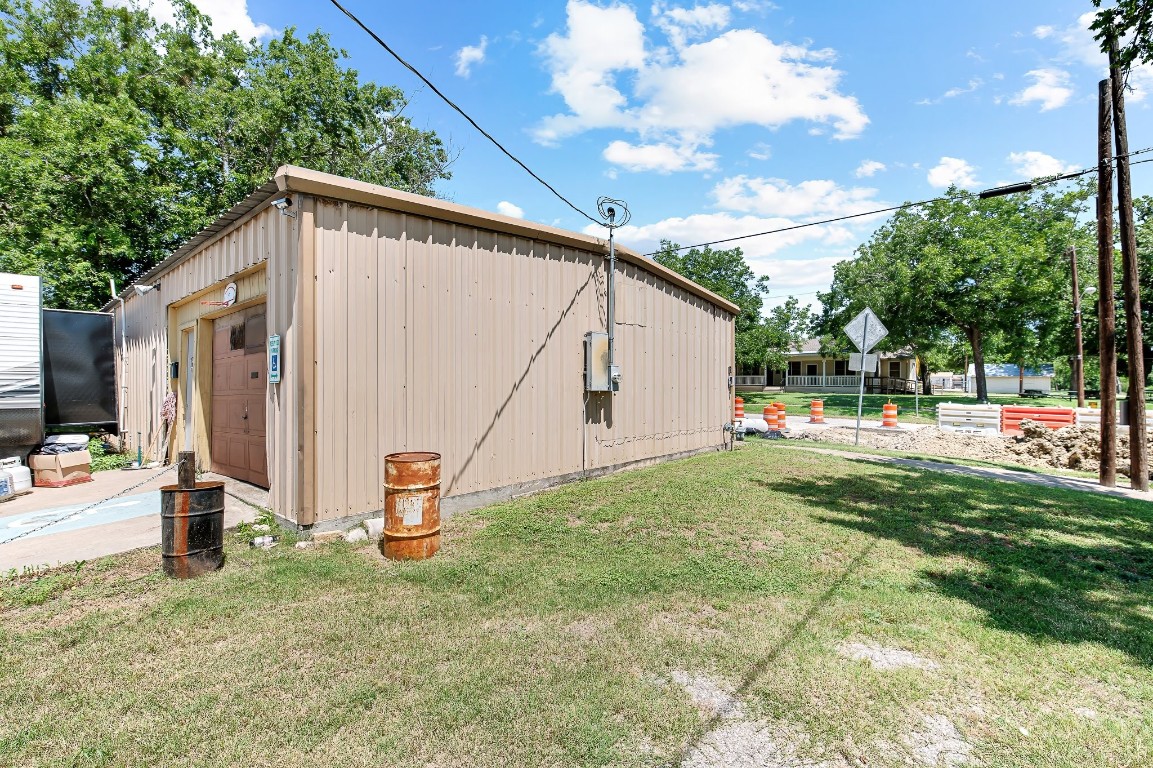 402 East 4th Street Taylor, TX 76574 - Photo 17 of 18 a backyard of a house with table and chairs