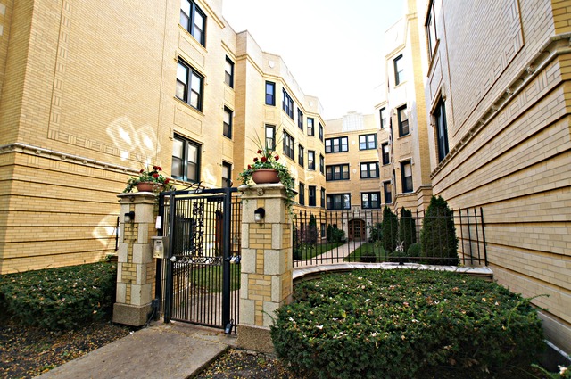 4110 North Keystone Avenue, Unit 3E Chicago, IL 60641 - Photo 2 of 21 a view of a brick building with many windows